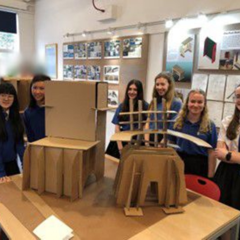 Team standing in front of their project - entered for the technology competition.