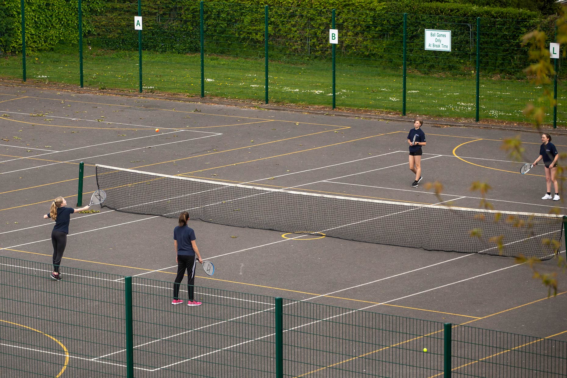 Students playing tennis