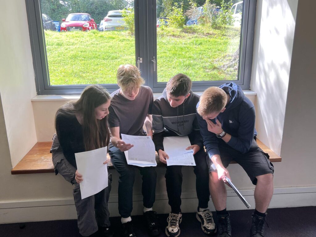 Students comparing GCSE exam results